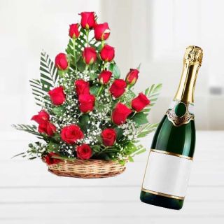 Basket arrangement of 40 red roses with bottle of champegne 
