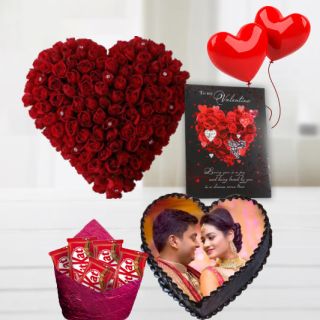 Heart shape arrangement of 50 red roses, 1 kg heart shape chocolate Photo cake, 2 heart shape balloons , pack of 5 kitkat chocolates with valentine card 