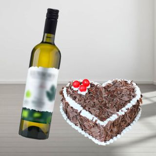 heart shape black forest fresh cream cake with bottle of  white wine
