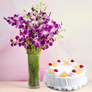 Bunch of 10 Lavender Orchids in glass vase with 1 pound fresh cream pine apple cake