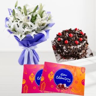 Bunch of white lilies with double chocolate cake with two box of celebration chocolates