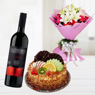 Bunch of roses with lilies and carnations with premium quality mix fruit fresh cream ith bottle of red wine 