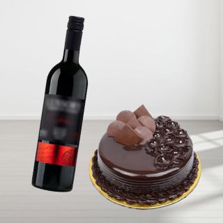 double chocolate cake with bottle of red wine
