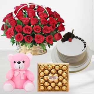 50 red roses basket arrangement , 1 feet height pink teddybear , premium quality vanilla cake , 24 pcs rocher ferrero chocolates 