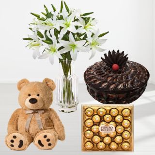 Vase arrangement of 10 white lilies, chocolate fudge cake, 24 pcs rocher ferrero chocolates with 1 feet height teddybear 
