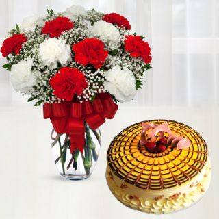 15 red and white carnations in glass vase with butterscotch premium quality cool cake 