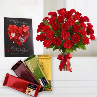 15 red roses with red carnations in glass vase with set of 4 temtations and valentine greeting card 
