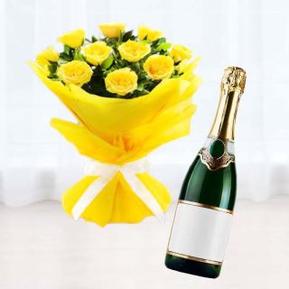 Bunch of 12 yellow roses with bottle of champegne