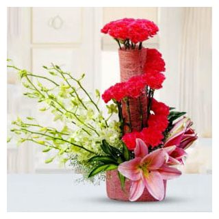 1 feet height exclusive arrangement of carnations and orchids 