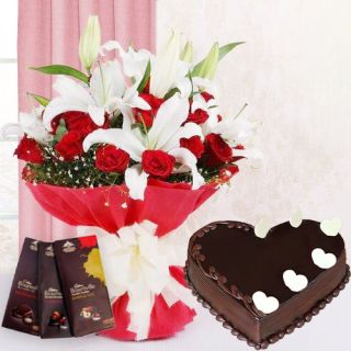 Bunch of white lilies& red roses with heart shape chocolate truffle cake with 3 bournville chocolates