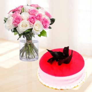 20 pink and white roses arranged in glass vase with half kg strawberry cool cake 