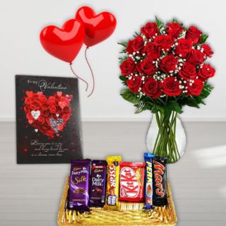 20 red roses vase arrangement ,Greeting card, 2 heart shape balloons, basket of assorted chocolates 