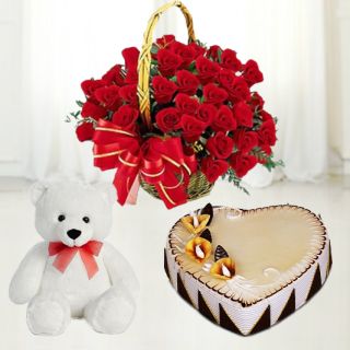 Basket arrangement of 20 red roses with 6 inch height teddybear with butterscotch heart shape cake