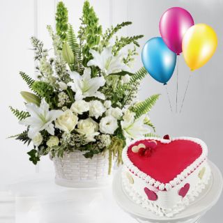 Arrangement of exotic white flowers with heart shape strawberry vanilla cake with 3 blown balloons