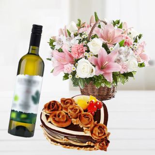 Basket arrangement of lilies with roses with heart shape premium quality chocolate  cake with bottle of  white wine