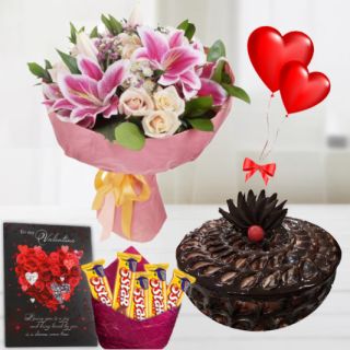 Bouquet of exotic mix flowers , half kg chocolate fudge cake, pack of Five 5star chocolates,  2 heart shape balloons , with greeting card 
