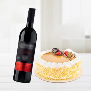 butterscotch cake with bottle of red wine