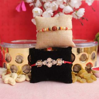 2 fancy rakhi with  box of 300 grams cashew raisins 