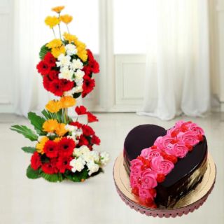 2 storey arrangement of 50 mix colour gerberas with 2 feet height with heart shape chocolate floral theme cake