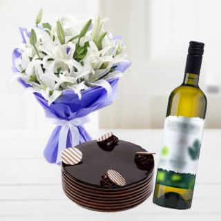 Bunch of 5 white lilies with double chocolate cake with bottle of white wine