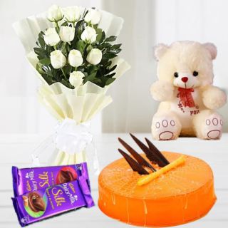 bunch of 12 white roses with 1 feet height teddybear with set of 2 dairy milk silk chocolates with orange cool cake 