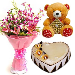 Bunch of lilies & orchids with 2 feet height teddy bear carrying 16 pcs Ferrero Rocher chocolates with black forest fresh cream cake 