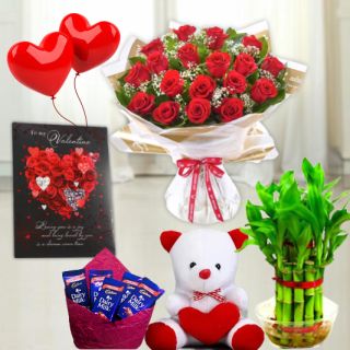 Twin heart shape arrangement of 30 red roses, set of 3 toblerone chocolates, 6 inch height teddybear, 2 layer Lucky bamboo plant, 5 blown balloons with greeting card 