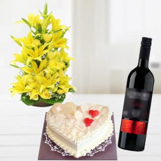 exotic arrangement of asiatic lilies with 2 feet height with vanilla heart shape cake with bottle of red wine