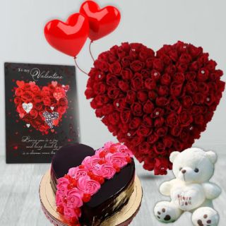 50  roses heart shape arrangement,1 kg heart shape chocolate cake  with floral theme, 1 feet height teddybear, valentine greeting card, 2 heart shape balloon 