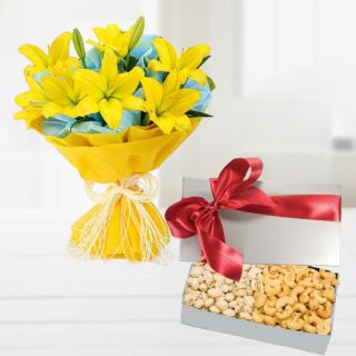 Bunch of 8 yellow asiatic lilies  with basket of half kg cashew and almonds