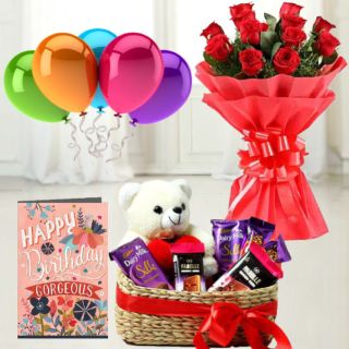 Bunch of 12 red roses, 6 inch teddybear sitting in chocolate basket with 4 silk , 2 fabelle chocolates,birthday  Greeting card with 5 blown balloons 