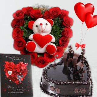 6 inch teddybear sitting in heart shape arrangement of 15 red roses, Half kg chocolate cake, pair of heart shape balloons, valentine card 