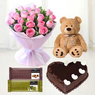 20 pink roses hand bouquet, chocolate heart shape cake, 1 feet height teddybear with set of 2 temptations chocolate 