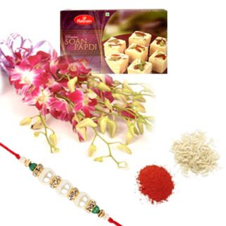 A beautiful bouquet of 10 orchids with 1 kg soan papdi with 1 rakhi and roli chawal