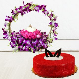 Basket arrangement of 10 Purple orchids, pink and white roses with red velvet cake