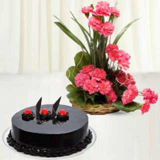 Basket arrangement of 20 pink carnations with chocolate truffle cake 