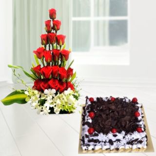 Basket arrangement of 20  red roses with 5 white orchids with black forest cool cake