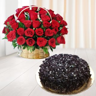 Basket arrangement of 25 red roses with chocolate fantasy cake 