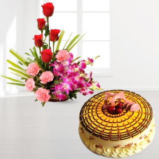 Basket arrangement of lavender orchids with red roses, pink carnations with butterscotch cool cake 