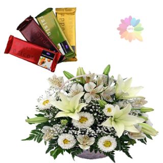 Basket arrangement of white exotic mix flowers with set of 4 temptations