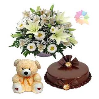 basket arrangement of white mix flowers with double chocolate cake with 1 feet height teddy bear