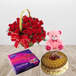 Basket of 30 red roses, butterscotch premium quality cake, 6 ich teddybear with box of celebration chocolates 
