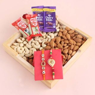 Basket of half kg cashew almond basket , set of 2 rakhis, with 4 assorted chocolates 