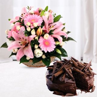 basket of lilies and gerberas with chocolate truffle cool cake 