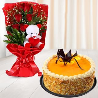 Beautiful bunch of 6 red roses with teddy bear sitting in it  with honey cool cake 