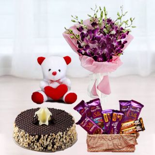 bunch of 8 purple orchids, basket of chocolates with Choco almond cake and 6 inches teddy bear