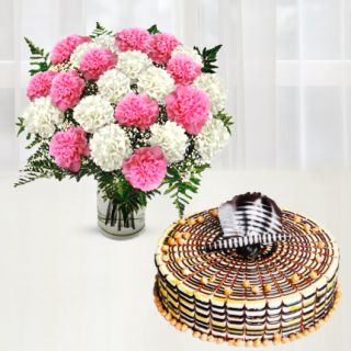 Beautiful vase arrangement of 20 pink and white carnations with butterscotch cake
