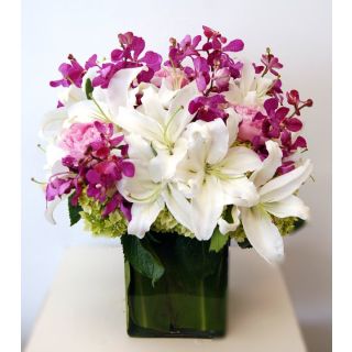 Beautiful vase arrangement of white lilies with purple orchids 