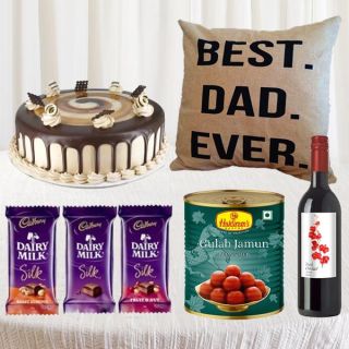 Bottle of red wine, 1 kg gulabjamun, set of 3 dairy milk silk, half kg coffee cake with photo cushion 