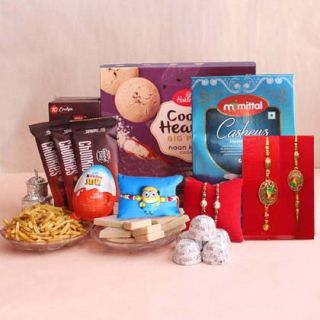 Box of cookies, 250 grams  kaju katli sweets, 200 grams cashew. 200 grams mixture ,kinder joy chocolate with 4 rakhis, an d 1 kid rakhi  
